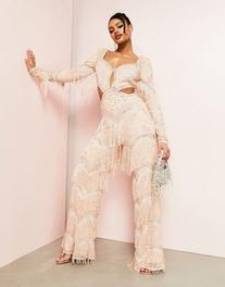 Oferta de ASOS LUXE cut out embellished jumpsuit with fringing in blush por $125.3 en ASOS