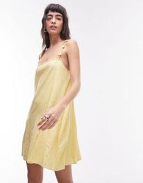 Oferta de Topshop floral strappy linen mini dress in yellow por $49.99 en ASOS