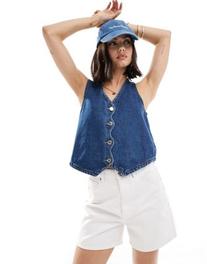 Oferta de Vero Moda denim waistcoat with wave detail in medium blue por $49.99 en ASOS