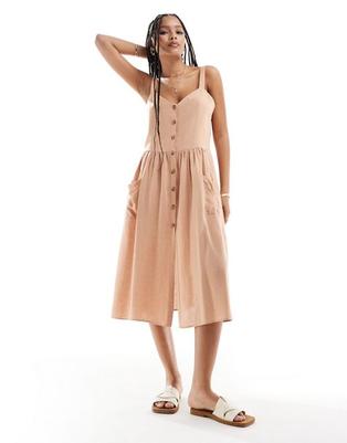 Oferta de ASOS DESIGN linen natural button through midi dress with pockets in biscuit por $36 en ASOS