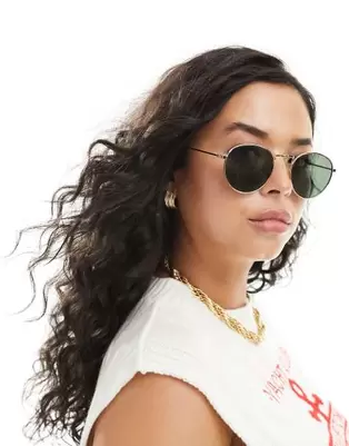 Oferta de ASOS DESIGN metal round sunglasses with G15 lens por $5.5 en ASOS