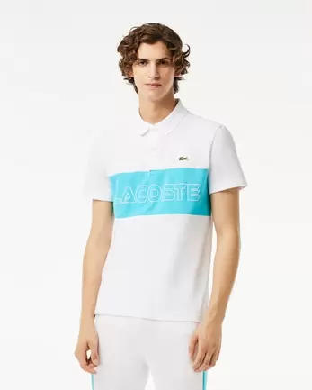 Oferta de Polo regular fit de piqué elástico con diseño color block por $1794 en Lacoste