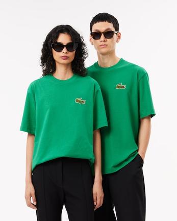 Oferta de Playera unisex holgada de algodón pesado con insignia por $1194 en Lacoste