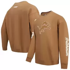 Oferta de Sudadera con cuello redondo y logo de los Detroit Lions de Aidan Hutchinson Brown Pro Standard para hombre por $2420 en Tienda NFL